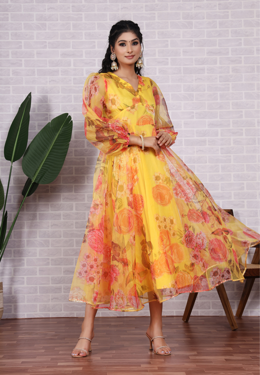 Feel Radiant in Yellow Organza with Beautiful Blossoms and Sheer Grace